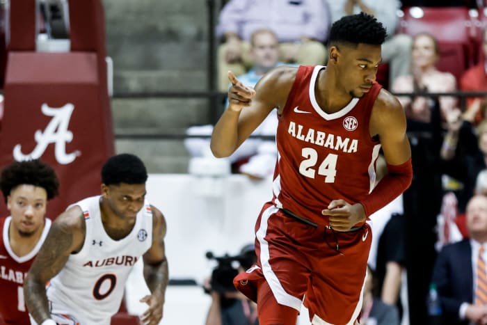 Alabama Crimson Tide forward Brandon Miller (24) reacts after making a three pointer against the Auburn Tigers during the first half of an NCAA basketball game at Coleman Coliseum.